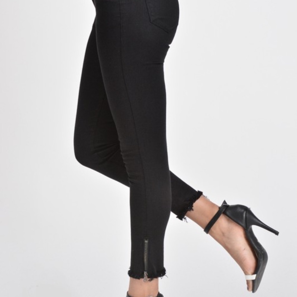 Kancan mid rise super skinny jeans with frayed hem and zipper detail at ankle.